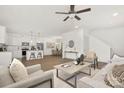 Open-concept living space featuring a stylish living room, dining area and a modern kitchen at 4217 Whispering Oaks Dr, Charlotte, NC 28213