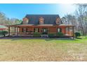 Inviting home with a cozy, covered porch and well-manicured front yard at 529 Langley Rd, Lancaster, SC 29720