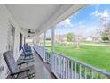 Inviting front porch with rocking chairs overlooking the lawn, perfect for relaxing at 705 Sagrada Dr, York, SC 29745