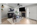 Stylish living room with fireplace, modern decor, and ample natural light, creating a welcoming atmosphere at 8220 Terra Linda Ln, Charlotte, NC 28215