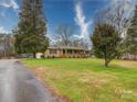 Spacious ranch home with well-kept lawn and a covered front porch at 1115 Kelly Rd, Mount Holly, NC 28120