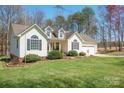 Charming single-story home with an attached two-car garage and landscaped front yard at 1505 Angela Ct, Lincolnton, NC 28092