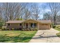 Lovely single-level home featuring a brick facade, front porch, attached garage, and a well-kept lawn at 1630 26Th Ne St, Hickory, NC 28601