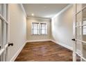 Bright office space featuring hardwood floors and a window with natural light at 1891 Felts Pkwy, Fort Mill, SC 29715