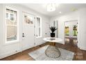 Welcoming foyer with hardwood floors, natural light, and stylish decor at 1922 Hamorton Pl, Charlotte, NC 28205