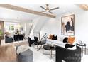 Open concept living area with modern furnishings and exposed wood beams at 1922 Hamorton Pl, Charlotte, NC 28205