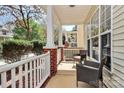Inviting front porch with comfortable seating, perfect for relaxing outdoors at 19613 Feriba Pl, Cornelius, NC 28031