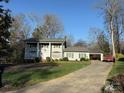 Wide shot of home with green lawn and a red truck parked in the driveway at 1968 12Th Street Ne Pl, Hickory, NC 28601