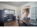 This office space shows dark wooden floors, a work station and french doors at 2010 Saddlebred Dr, Iron Station, NC 28080