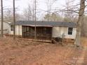 Backyard features a screened-in porch, perfect for relaxing and entertaining outdoors at 2130 Babbling Brook Ln, Gastonia, NC 28052