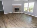 Bright living room with fireplace and newer flooring at 2130 Babbling Brook Ln, Gastonia, NC 28052