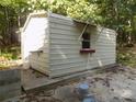 Exterior shot of the metal outbuilding in the rear of the property at 2130 Babbling Brook Ln, Gastonia, NC 28052