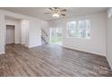 Bright living room with patio access, large windows, and stairway access at 2583 Watson Dr, Lancaster, SC 29720