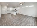 Modern kitchen featuring stainless steel appliances, white cabinets, granite countertops, and hardwood flooring at 2591 Watson Dr, Lancaster, SC 29720