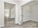 Bright room with modern gray wood floors and doorway with glass door at 2822 Woodlands Creek Dr, Monroe, NC 28110