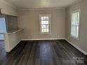 Bright living room featuring sleek floors, neutral paint, and natural light streaming through the window at 3703 Crawford St, Gastonia, NC 28052