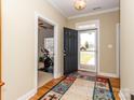 Inviting entryway with a view into a sunlit room, showcasing an open and airy floor plan at 3816 Sonoma Way, Monroe, NC 28110