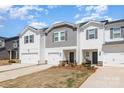 Well-maintained townhome exterior with a one-car garage, neutral siding, and landscaping in a suburban neighborhood at 3870 County Down Ave, Kannapolis, NC 28081