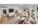 Bright living room boasts hardwood floors, and stylish furnishings at 475 Union Baptist Church Rd, York, SC 29745