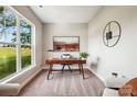 Bright office space with large window, stylish desk, and comfortable seating area for work or relaxation at 522 Fern Hill Rd # 17, Mooresville, NC 28117