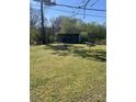 Large grassy backyard with utility shed, perfect for outdoor activities at 529 Devine St, Chester, SC 29706