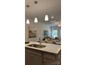 Modern kitchen featuring granite counters and stainless steel faucet with seating area in the background at 5821 Tuckaseegee Rd # 12, Charlotte, NC 28208