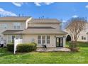 The backyard features a cozy stone patio, ideal for relaxing and enjoying the outdoor space at 5980 Pale Moss Ln, Charlotte, NC 28269