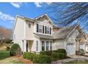 Exterior view showcasing this charming home with well-maintained landscaping and inviting front entrance at 5980 Pale Moss Ln, Charlotte, NC 28269