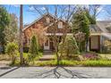 This charming brick home features mature trees and beautiful landscaping at 719 N Fulton St, Salisbury, NC 28144