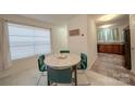 A cute dining room with a table and four chairs, creating a cozy and intimate space at 746 Elders Story Rd, Fort Mill, SC 29708