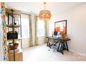 Bright office space with modern desk, shelving, and colorful accents, perfect for productivity at 8026 Cedarsmith Ct, Charlotte, NC 28217