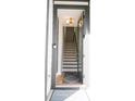 Inviting entryway with a staircase, hardwood floors, and modern lighting at 8034 Cedarsmith Ct, Charlotte, NC 28217