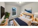 Comfortable bedroom featuring a cozy bed with throw pillows, a window, and stylish decor at 89 Fifth St, York, SC 29745