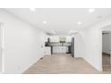 Bright, open-concept living space with recessed lighting and sleek, modern flooring at 902 Grace St, Kings Mountain, NC 28086