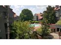 Inviting community pool surrounded by lush greenery and well-maintained landscaping, perfect for relaxation at 9035 Jm Keynes Dr # 39, Charlotte, NC 28262
