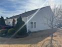 Backyard view showing a well-maintained lawn and landscaping around the property at 905 Roxburgh Ave, Rock Hill, SC 29732