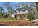 View of the side of a beautiful home with a covered porch and well-maintained landscaping at 7214 Benita Dr, Charlotte, NC 28212