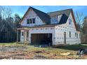 Exterior elevation of home featuring a two-car garage at 128 Kepli Way, Mooresville, NC 28115