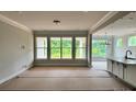 Open-concept living area featuring abundant natural light and seamless flow into kitchen at 1453 Ardmore Dr # 240, Sherrills Ford, NC 28673