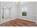 Elegant dining room with hardwood floors, crown molding, and a view into the entryway at 2082 Egret Ct, Rock Hill, SC 29732