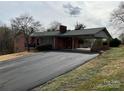 Exterior shot featuring covered parking and paved driveway at 356 Lucky Hollow Rd, Hickory, NC 28601