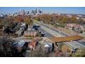 Scenic aerial view of a neighborhood, with a skyline in the distance, showcasing community and location at 610 Hawthorne Ln, Charlotte, NC 28204