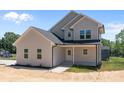 Two-story home with a covered front porch and modern siding at 106 Desert Sky Ct, Statesville, NC 28625
