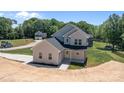 Two-story home features an attached garage and well-manicured landscaping at 106 Desert Sky Ct, Statesville, NC 28625