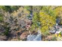 Aerial shot of the house nestled among mature trees at 1119 Palmyra Dr, Tega Cay, SC 29708