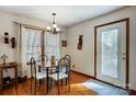 Cozy dining room with hardwood floors, natural light, and seating for four at 1119 Palmyra Dr, Tega Cay, SC 29708