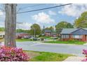 Neighborhood street view with visible skyline, showcasing location near urban amenities at 1400 Russell Ave, Charlotte, NC 28216