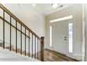 Bright foyer with wood floors, staircase and white front door with sidelights perfect for welcoming guests at 1449 Ardmore Dr # 241, Sherrills Ford, NC 28673