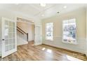 Sunlit living room with pristine hardwood floors, complemented by white trim and large windows for natural light at 1449 Ardmore Dr # 241, Sherrills Ford, NC 28673