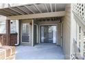 Relaxing covered patio with sliding glass doors, offering a private outdoor living space at 1606 Sharon W Rd # 37, Charlotte, NC 28210